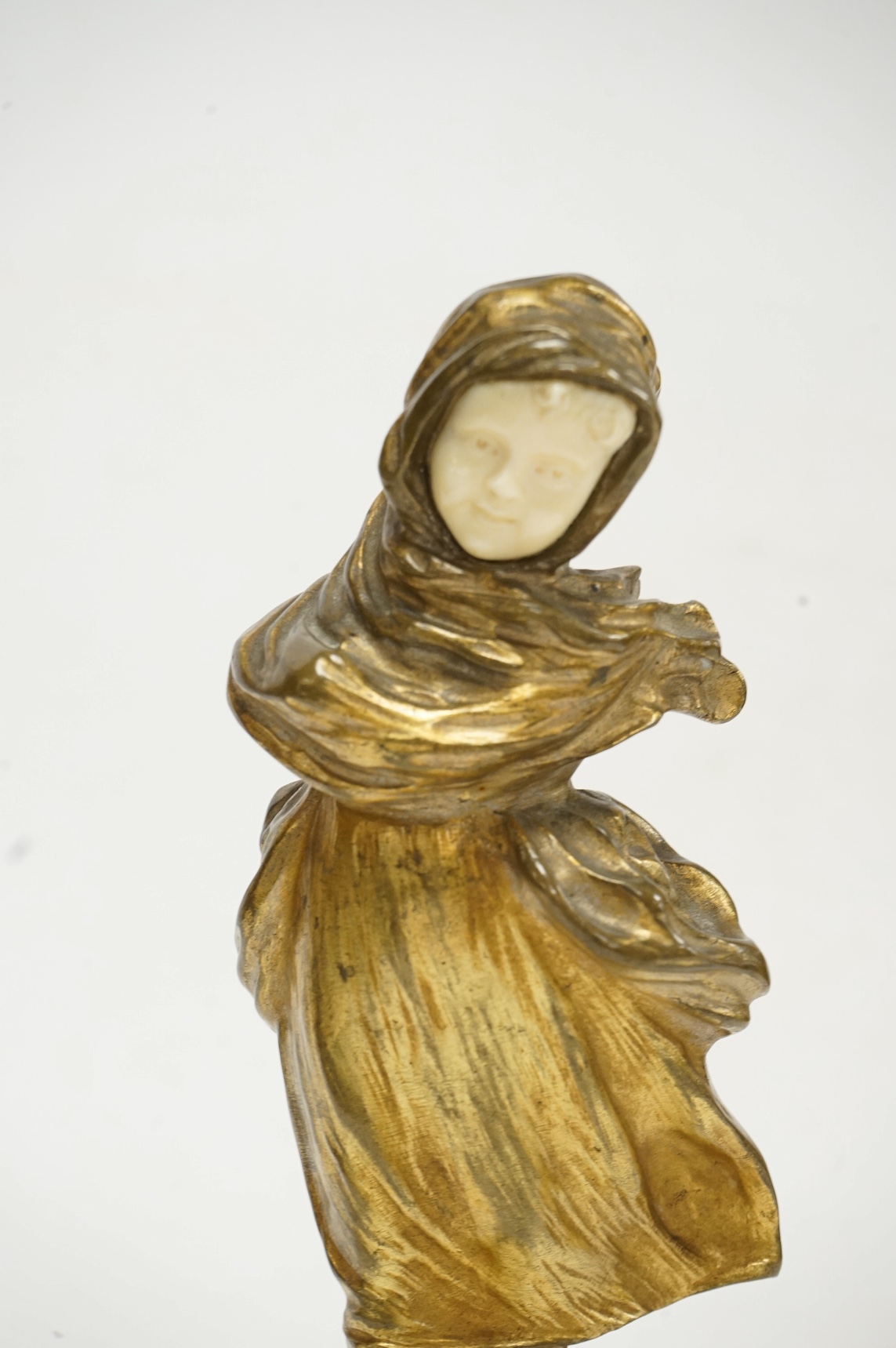 After Affortunato Gory, a bronze and ivory figure of a windswept skating girl, incised script signature to granite base, 19cm high. CITES Submission reference LWATX8X8